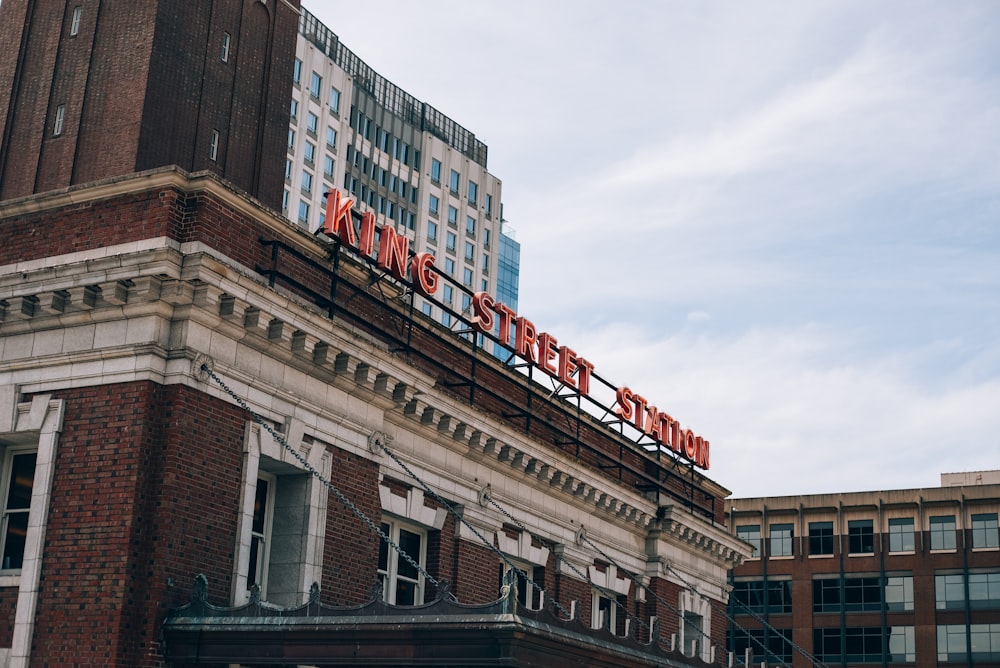 a large brick building with a sign on top of it