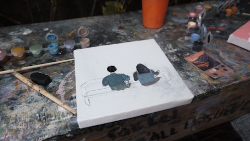 a picture of two people sitting on a couch