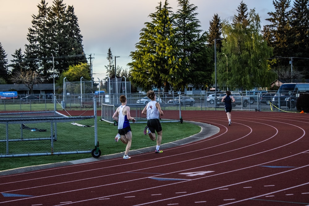 a group of people running on a track