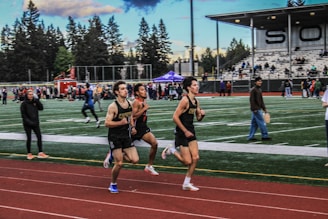a group of men running on a track
