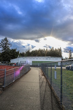 a tennis court with a tennis court in the background