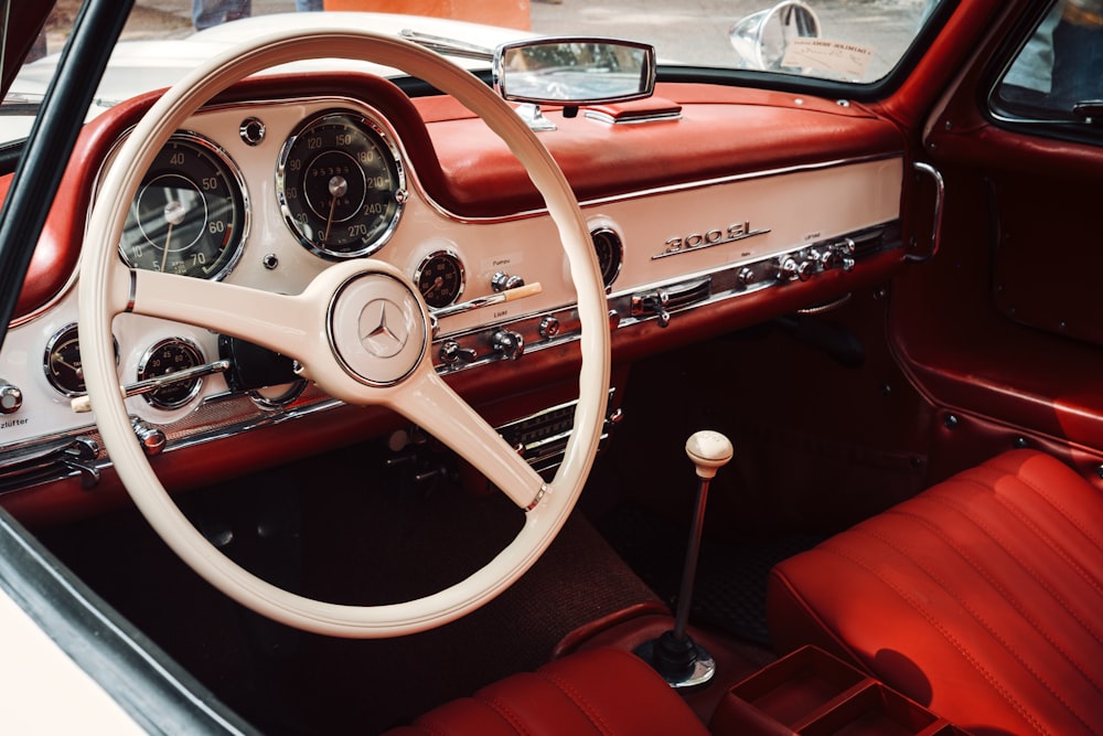 the interior of a car with a steering wheel and dashboard