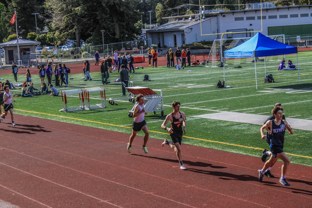 a group of people running on a track