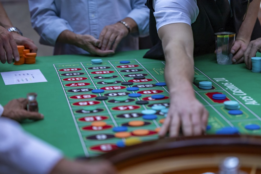 a group of people playing a game of crap at a casino