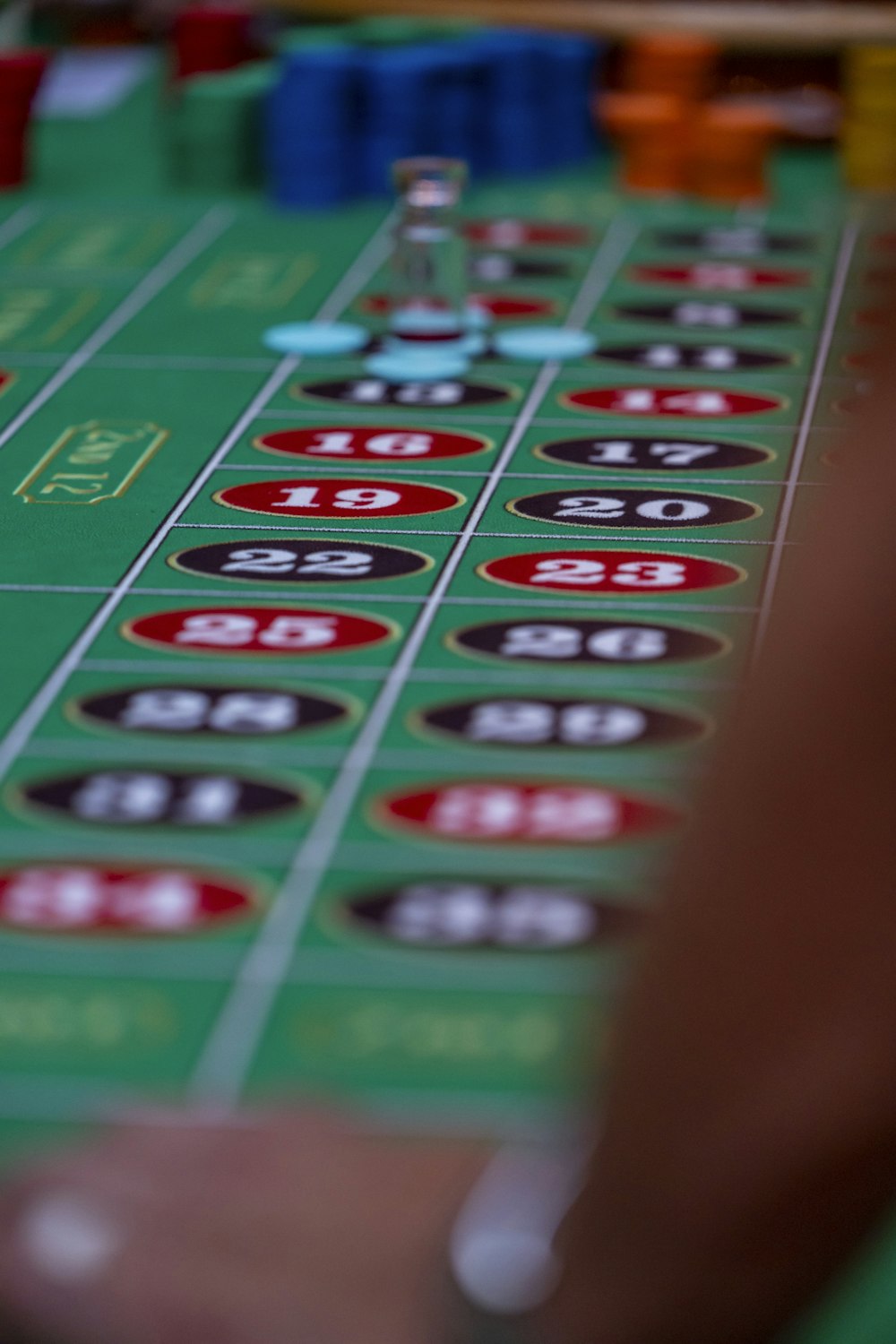 a close up of a casino table with a lot of chips