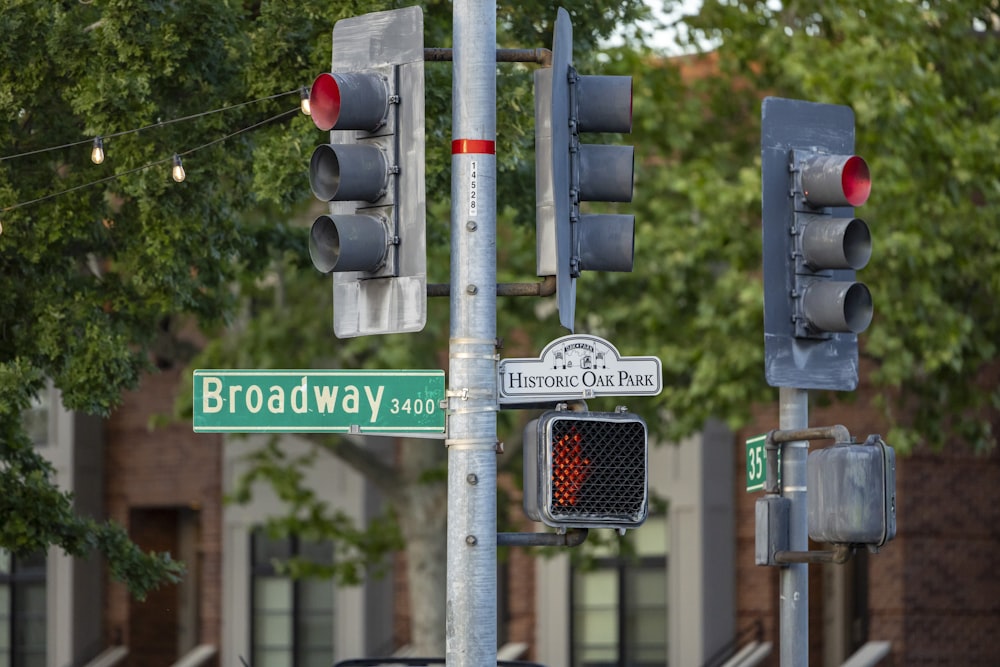 a couple of traffic lights sitting on the side of a road