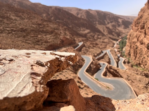 a view of a winding road in the mountains