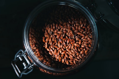 a glass jar filled with lots of seeds
