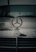a mercedes emblem on the front of a car