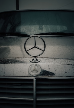a mercedes emblem on the front of a car
