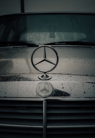 a mercedes emblem on the front of a car