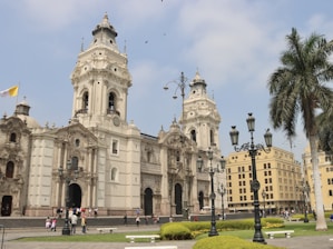 a large white building with a clock tower
