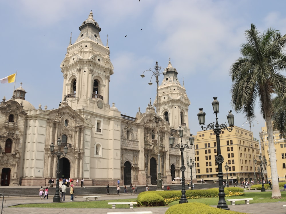 a large white building with a clock tower