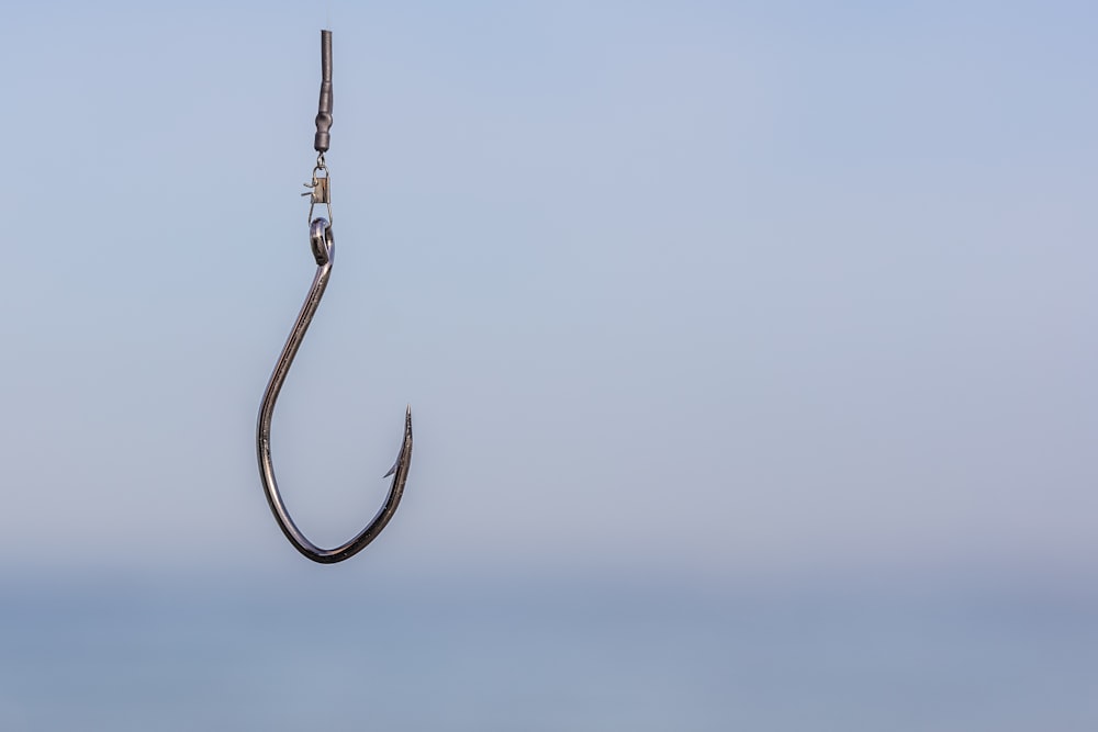 a fishing hook hanging from the side of a boat