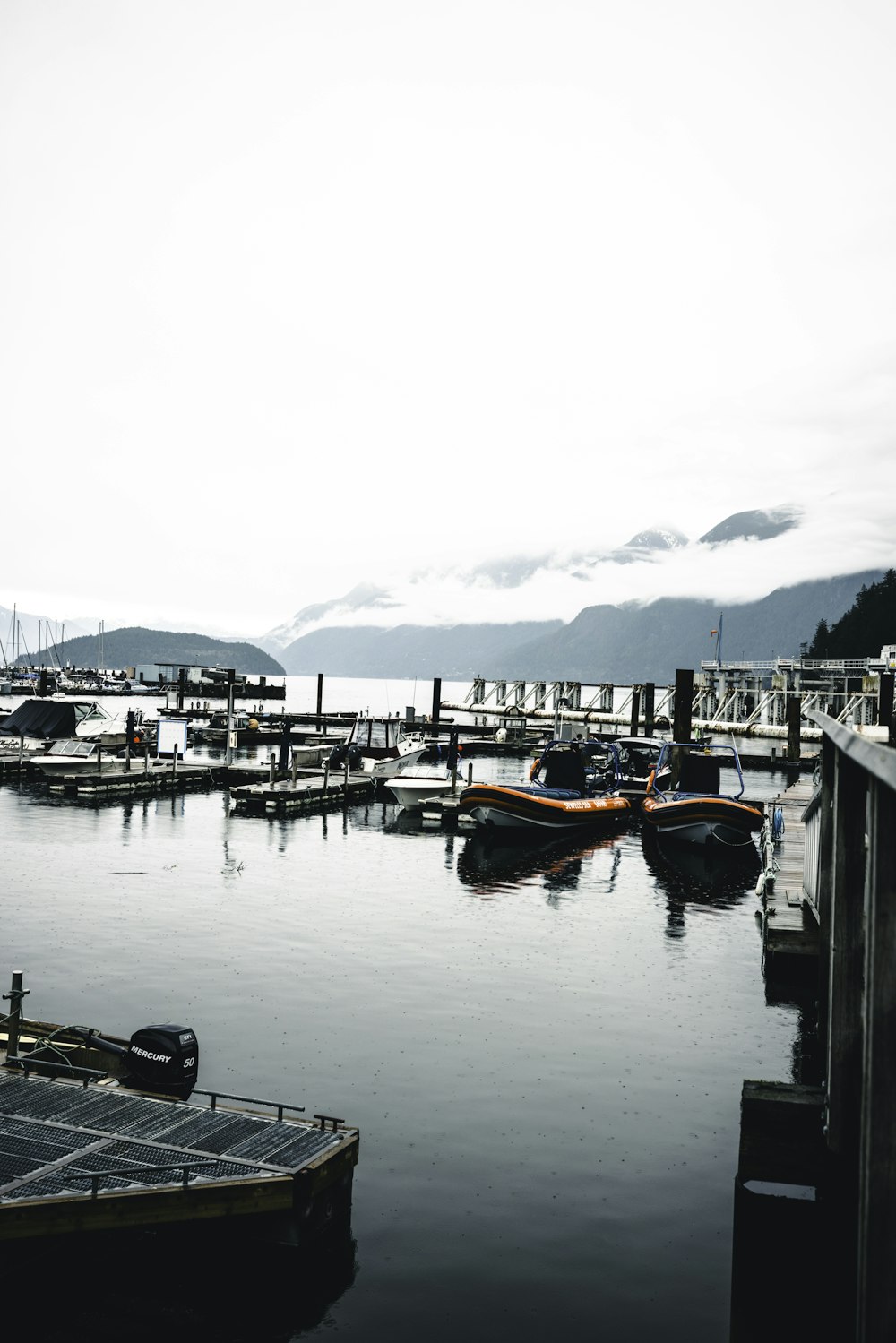 a group of boats that are sitting in the water