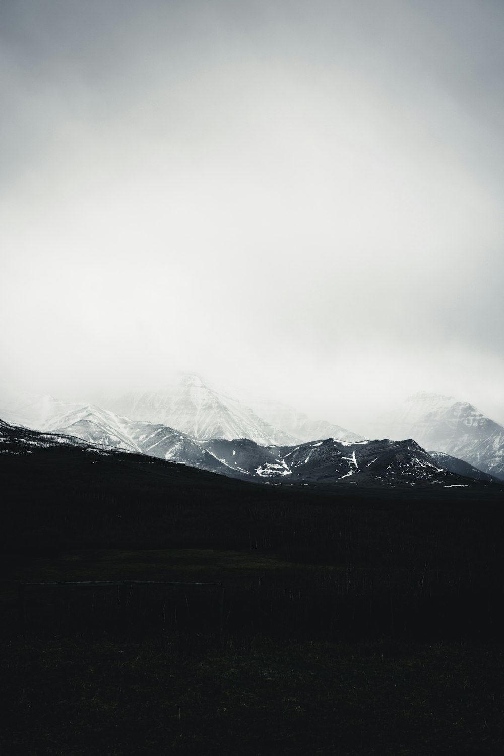 a black and white photo of a mountain range