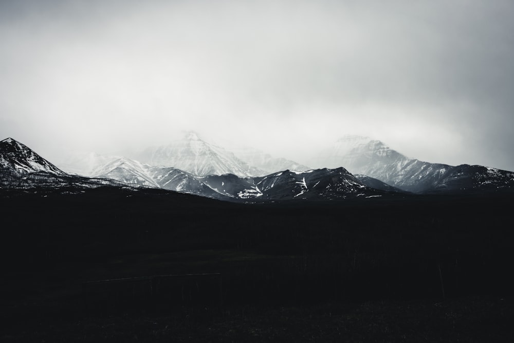 a black and white photo of a mountain range