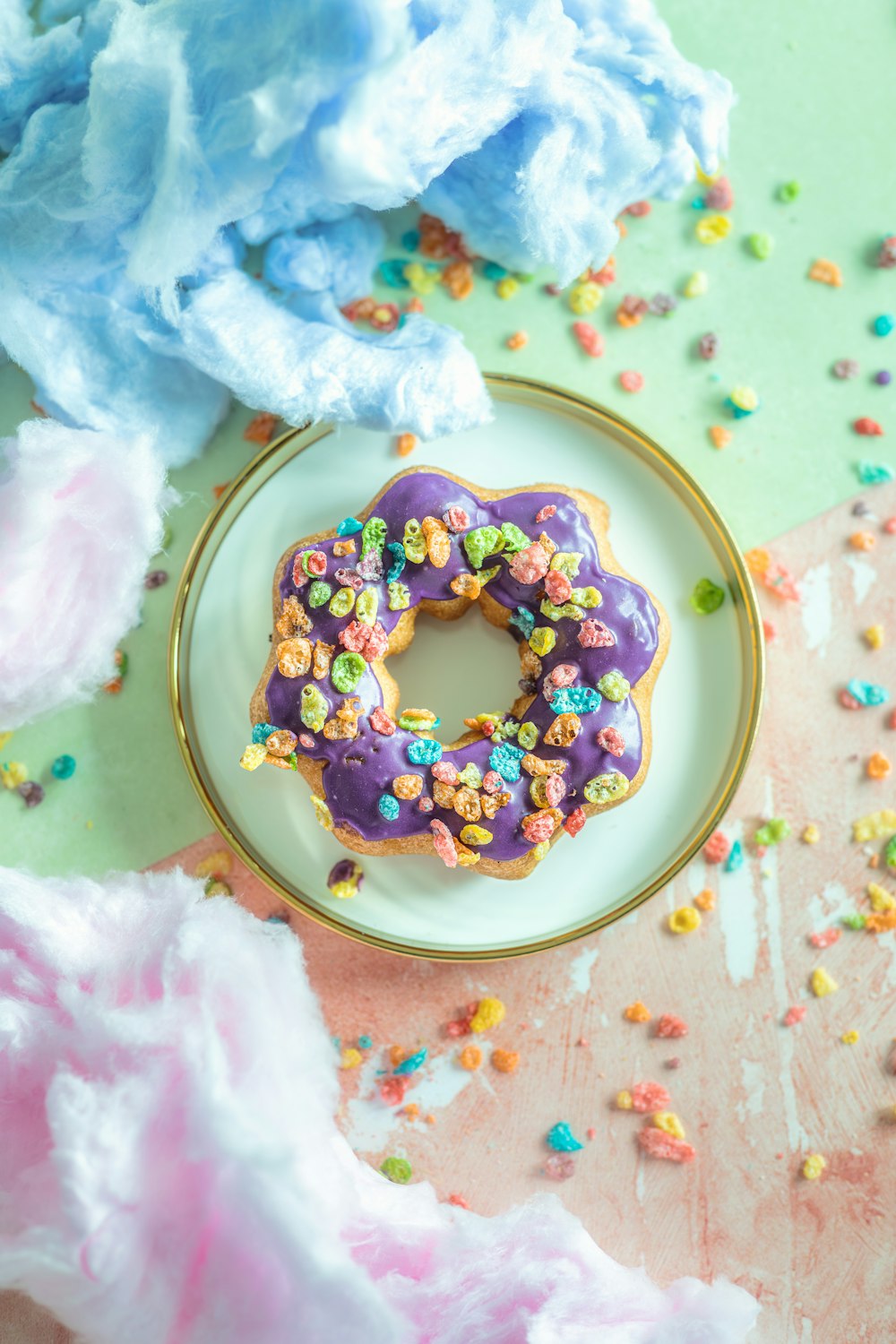 a donut with sprinkles on a plate