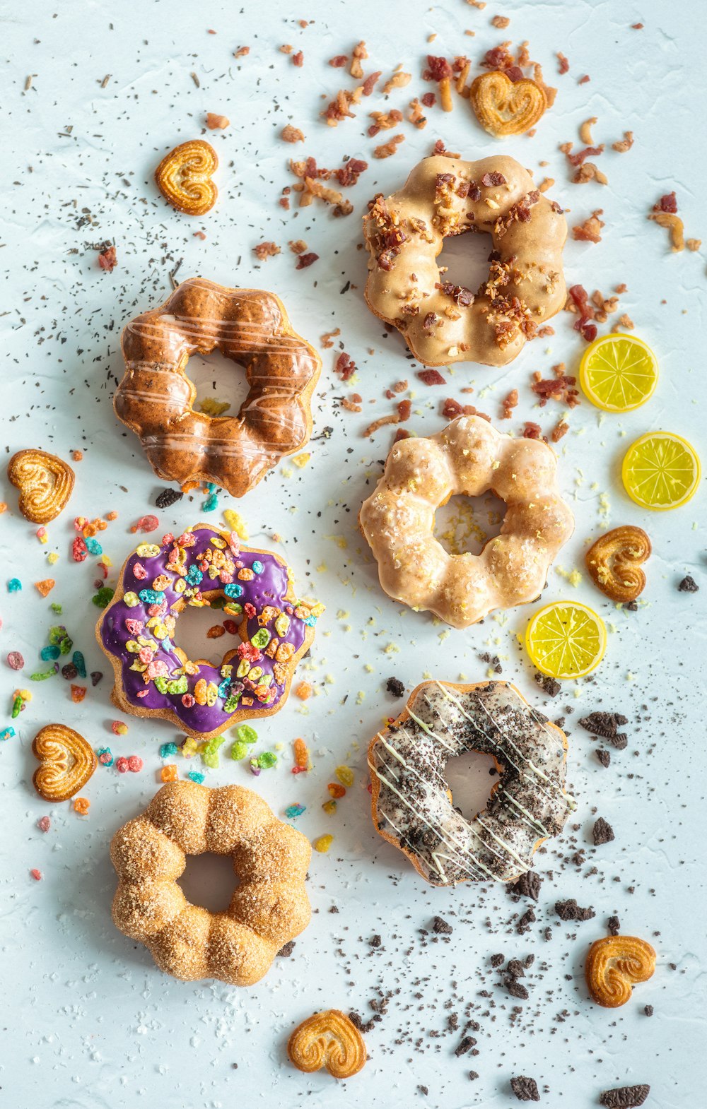 a variety of doughnuts and pastries on a table