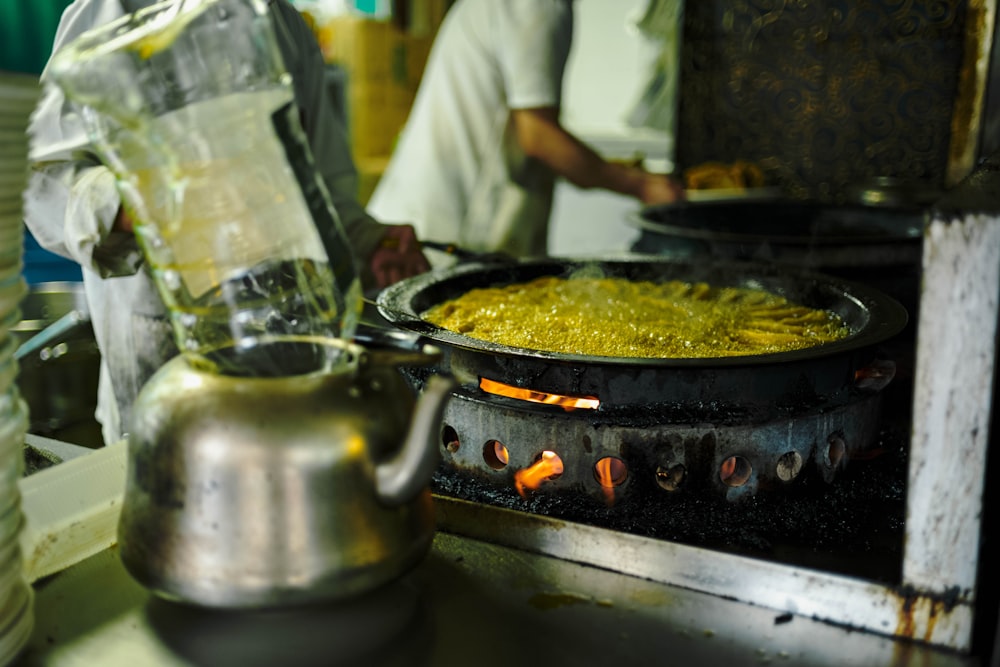 a pan of food is being cooked on a stove
