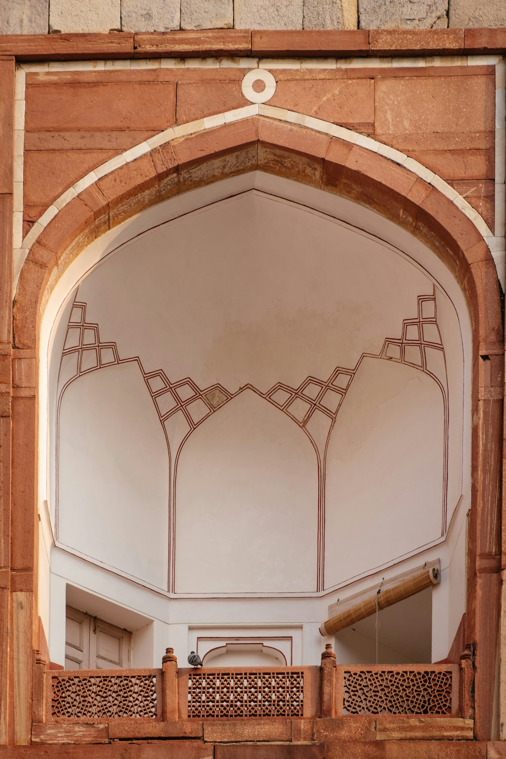 an arch in a building with a clock on it