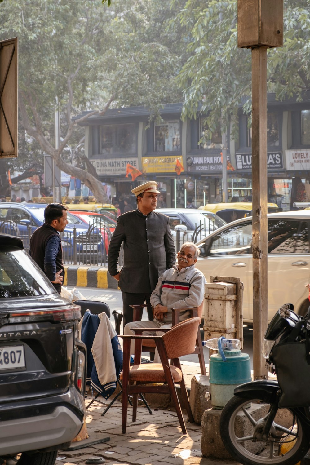 a man standing next to a child on a chair