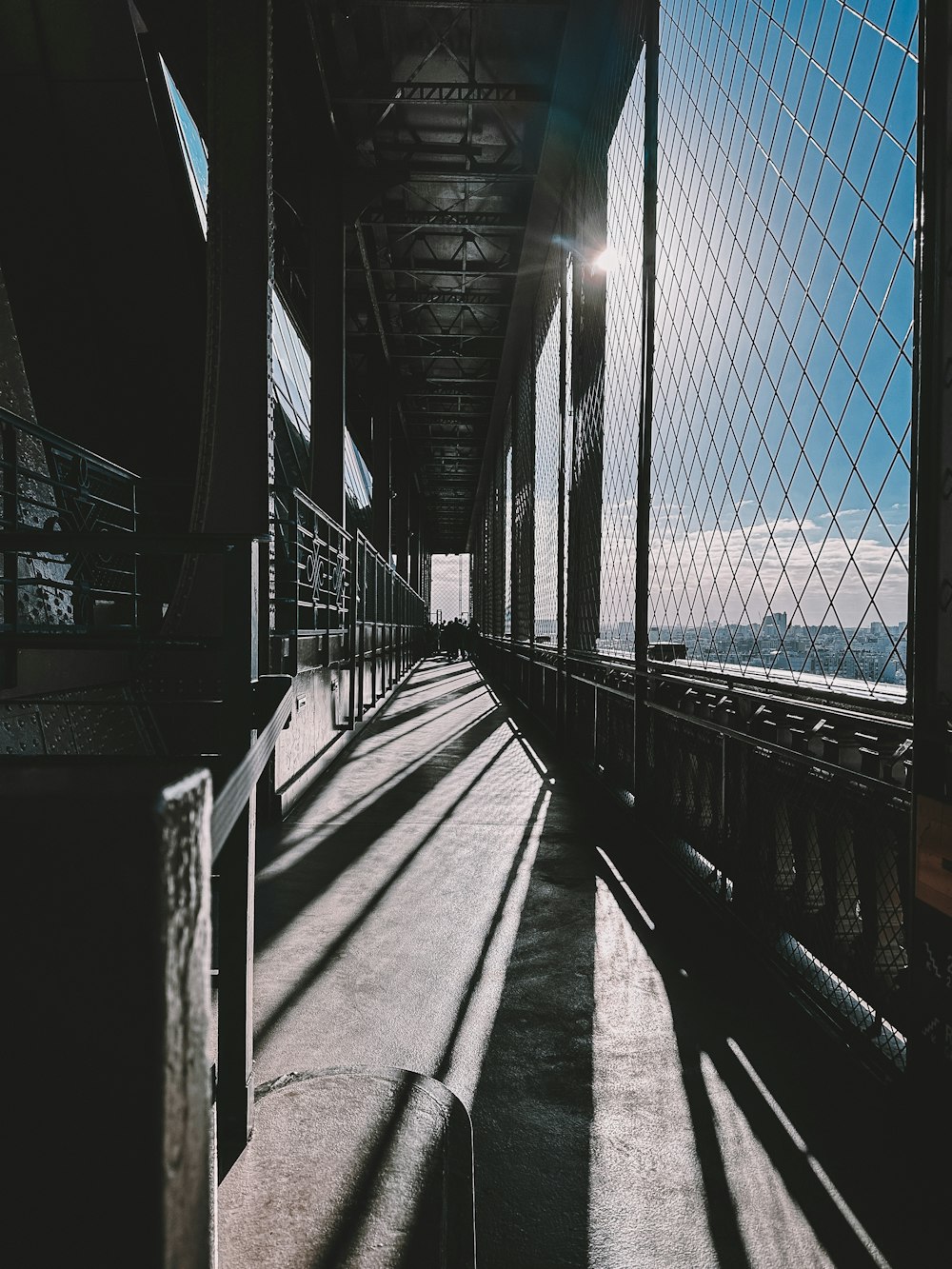 the sun shines through the windows of a bridge