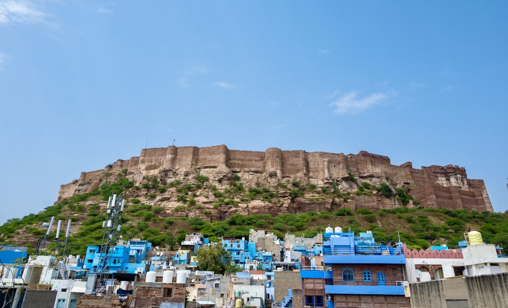 a very tall hill with a very tall building on top of it