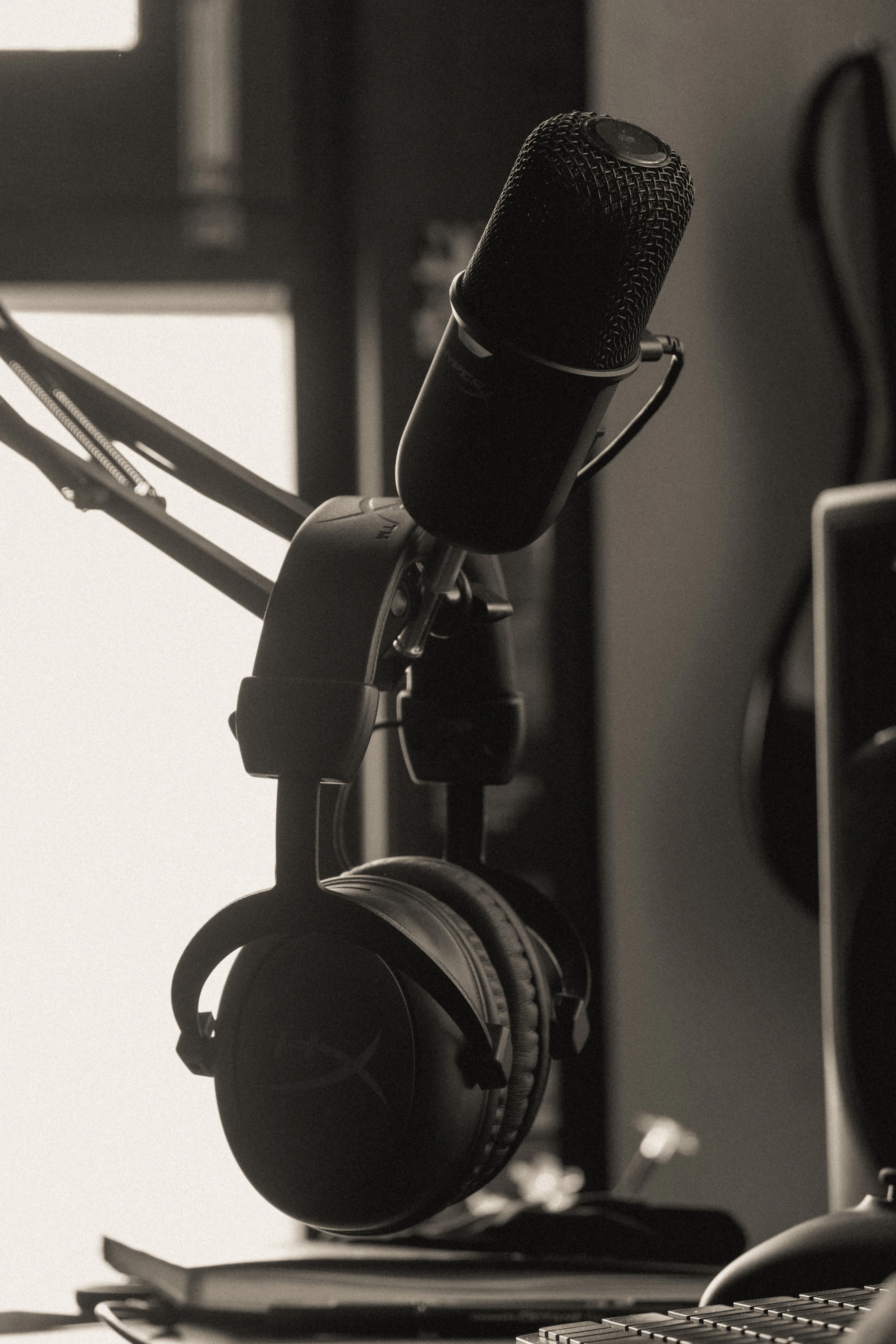 Professional podcast microphone and headphones in a recording studio