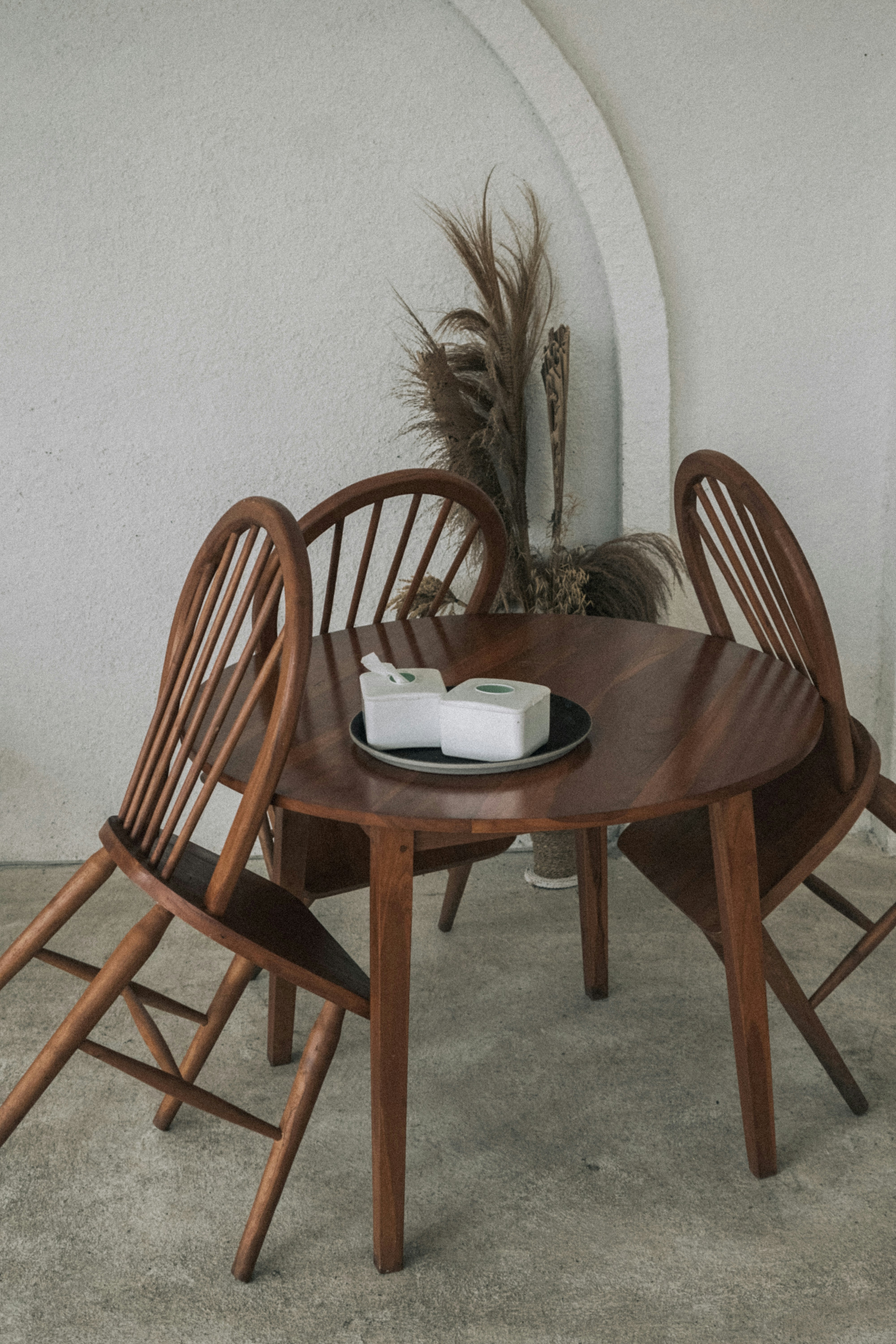 a wooden table with chairs around it