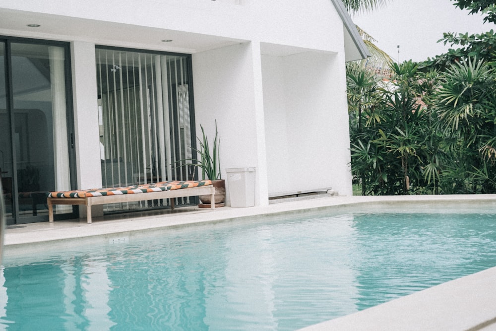 a pool with a bench next to it