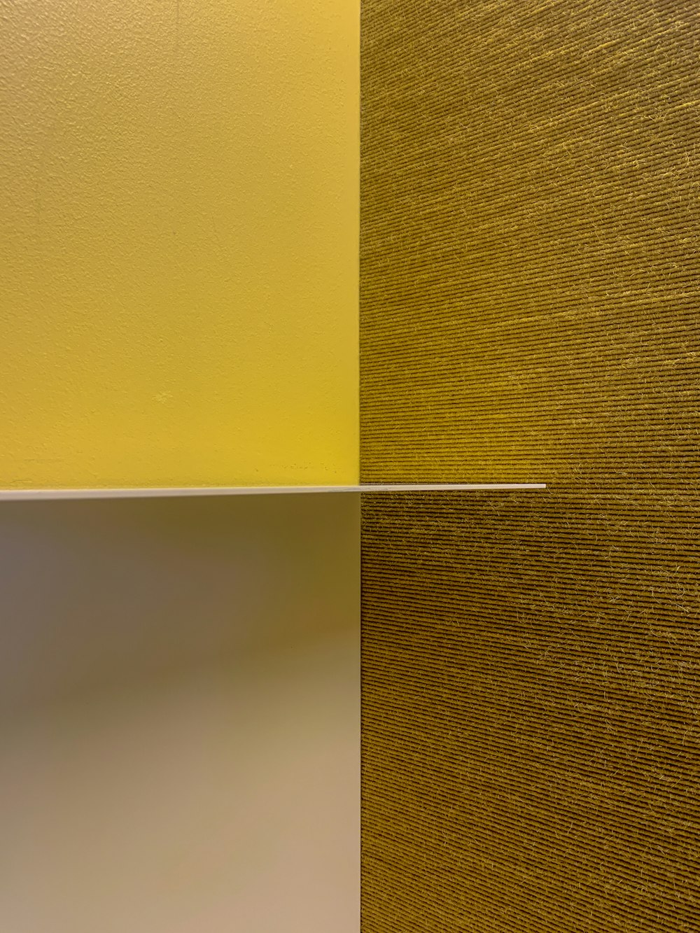 a yellow and white wall and a white and yellow wall