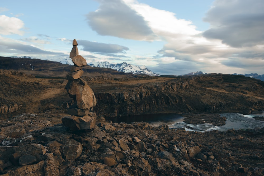 a pile of rocks sitting on top of a rocky hillside