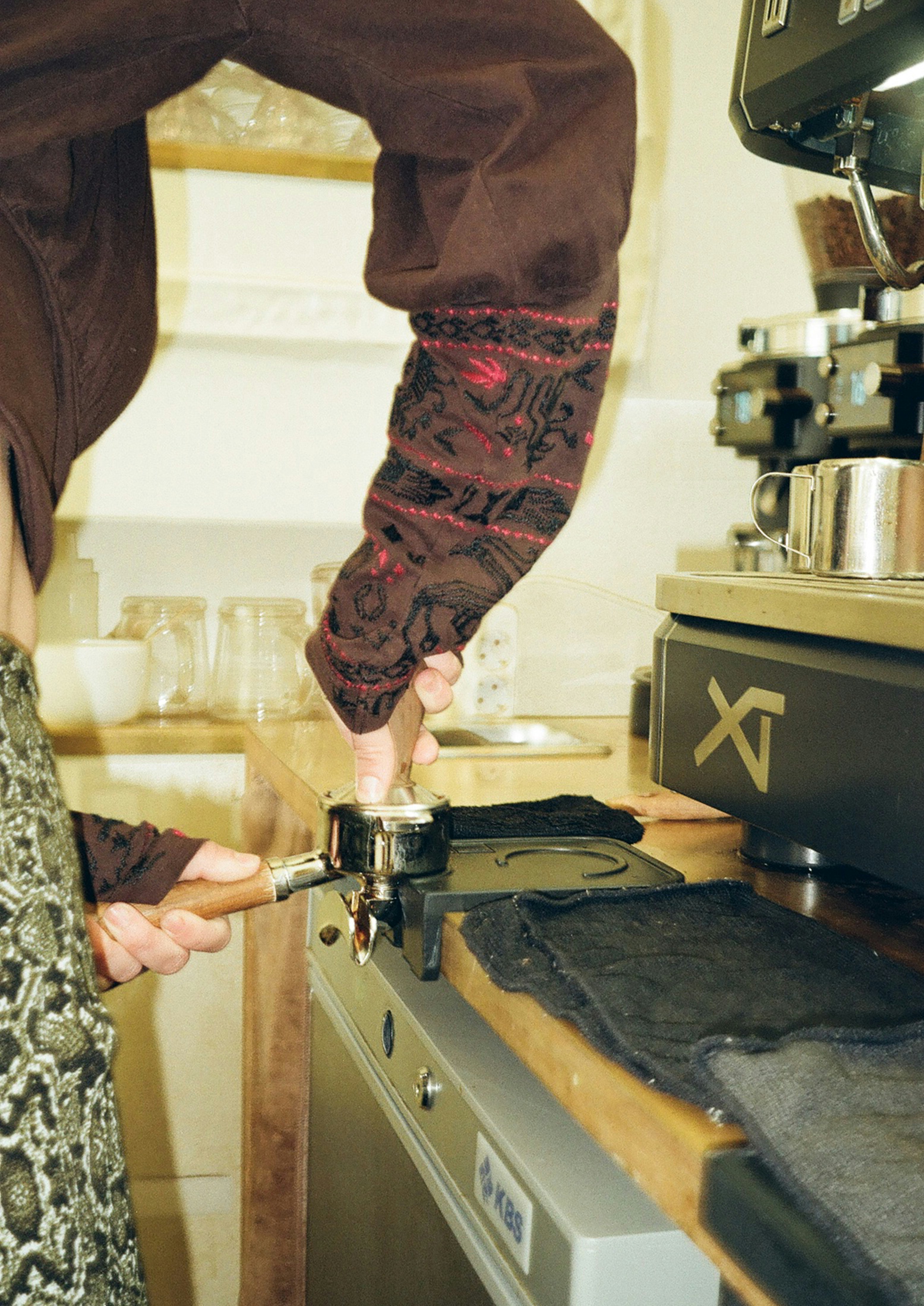 a person using a pair of scissors to cut fabric