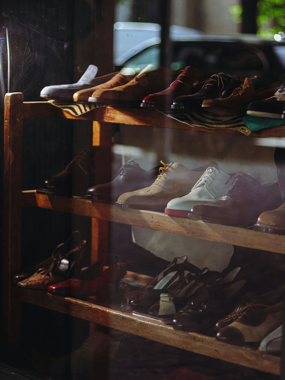 a bunch of shoes that are on a shelf