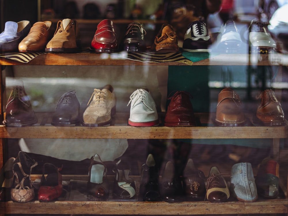 a display case filled with lots of different types of shoes