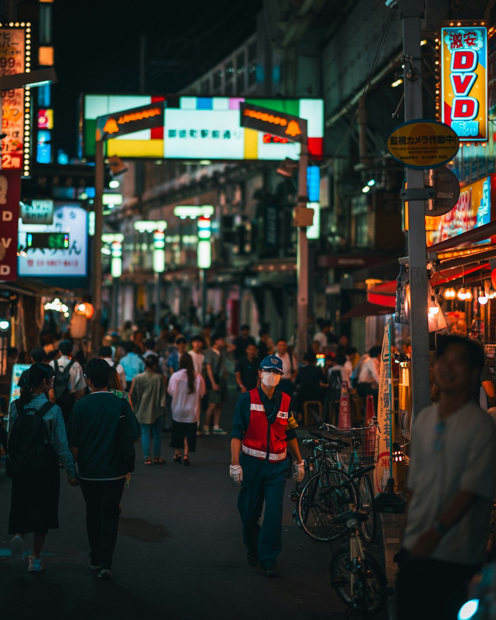 a crowded city street filled with lots of people