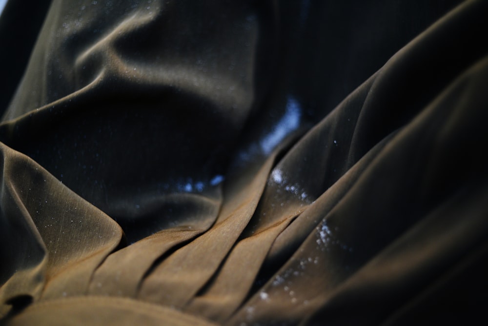 a close up of a cloth with water droplets on it