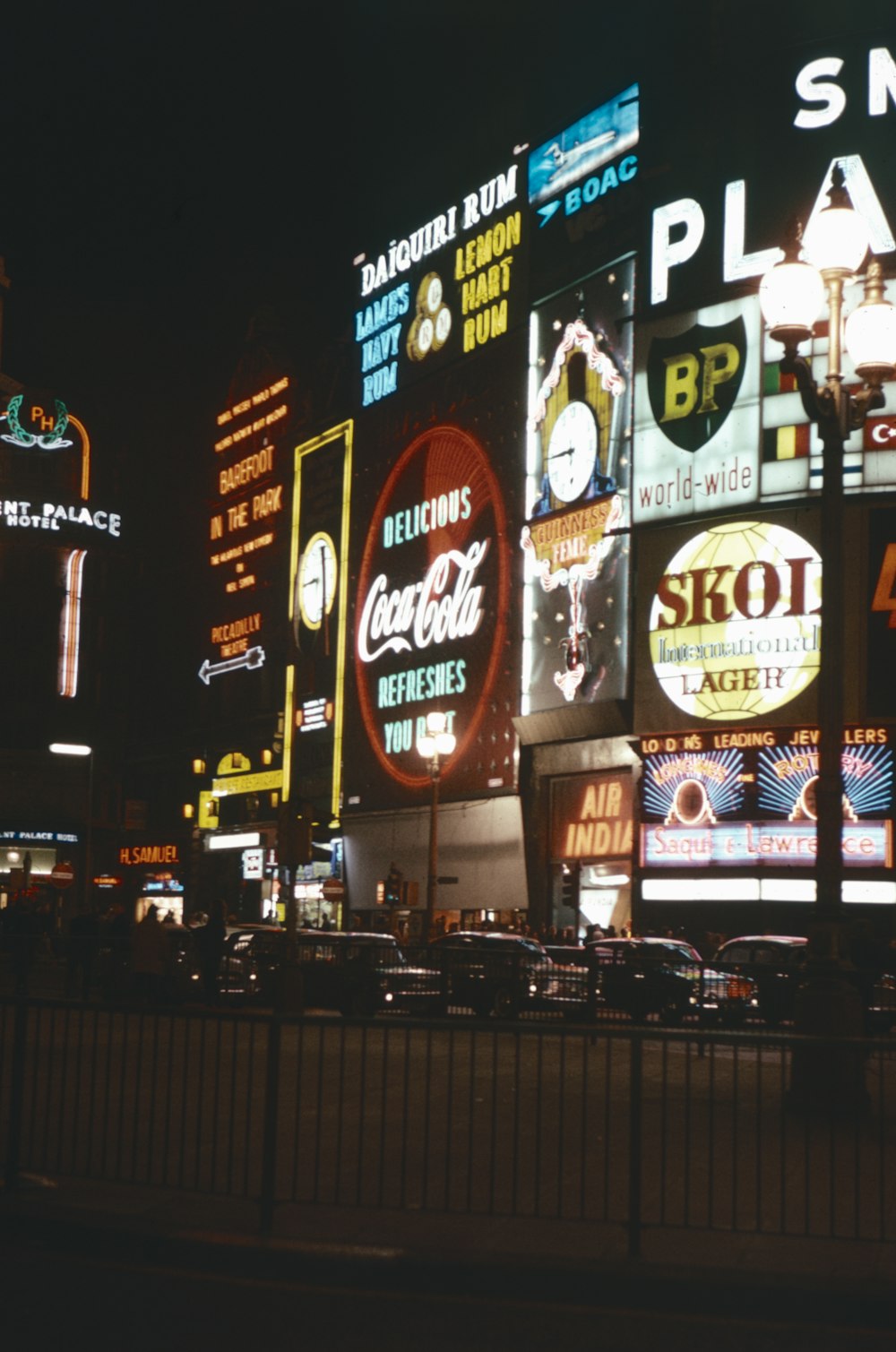 a city street filled with lots of neon signs