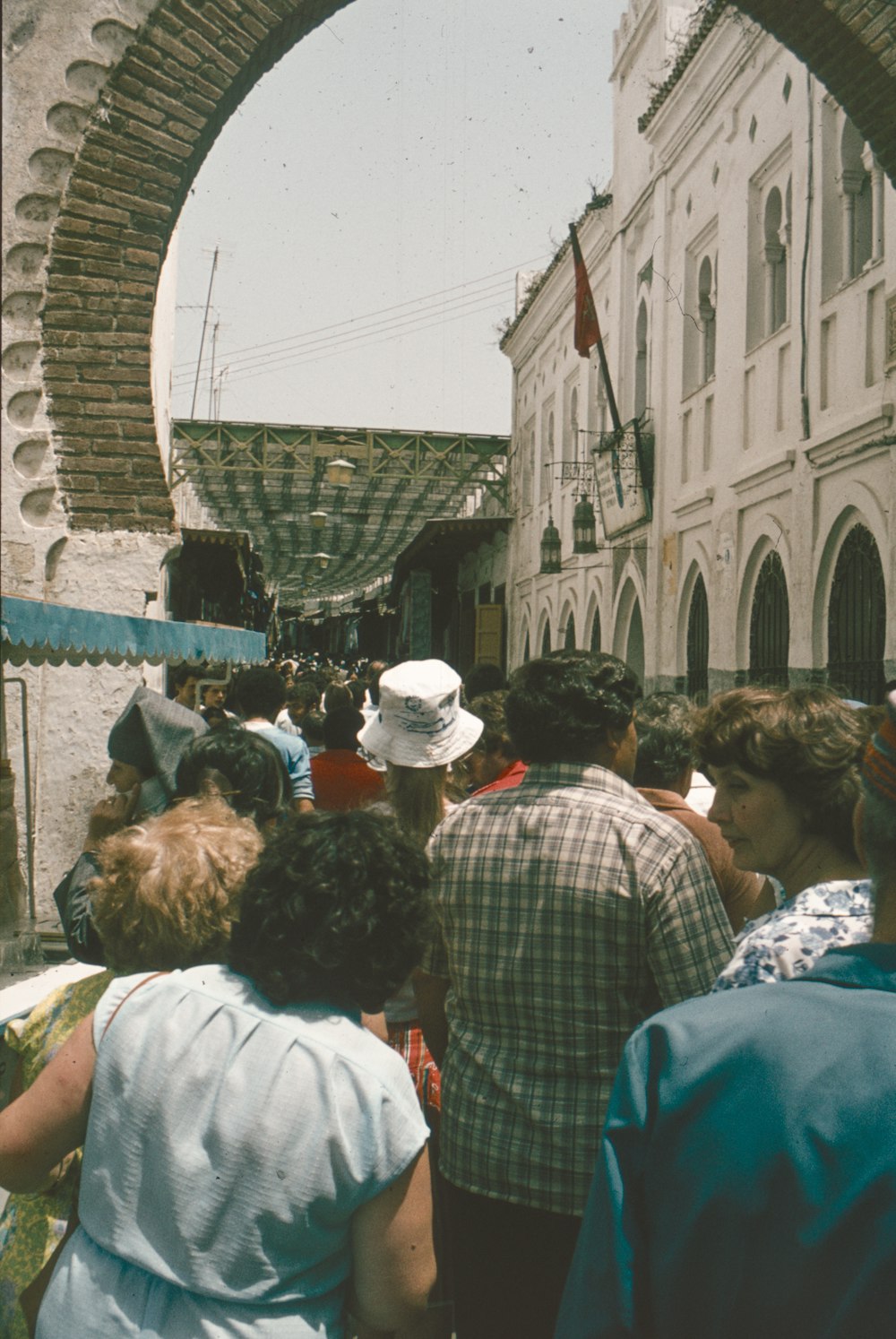 a group of people standing in front of a building