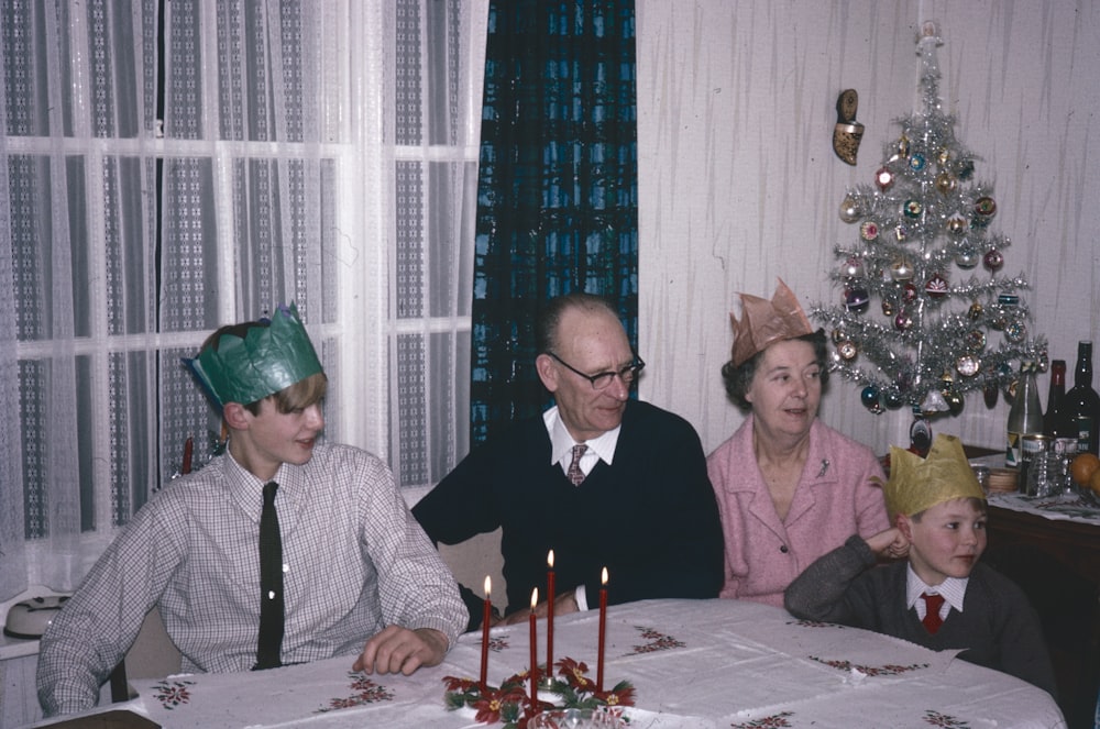 a group of people sitting around a table