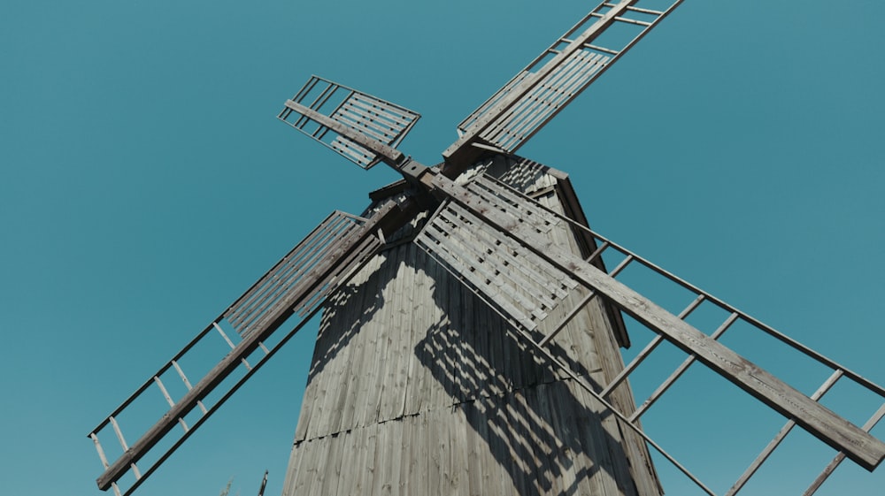 a windmill with a blue sky in the background