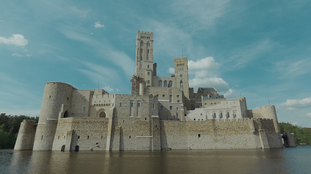 a large castle sitting on top of a body of water