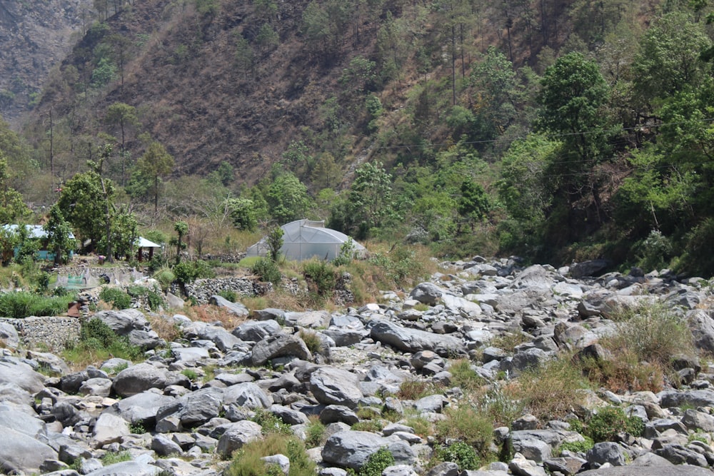 there is a small tent in the middle of the rocks