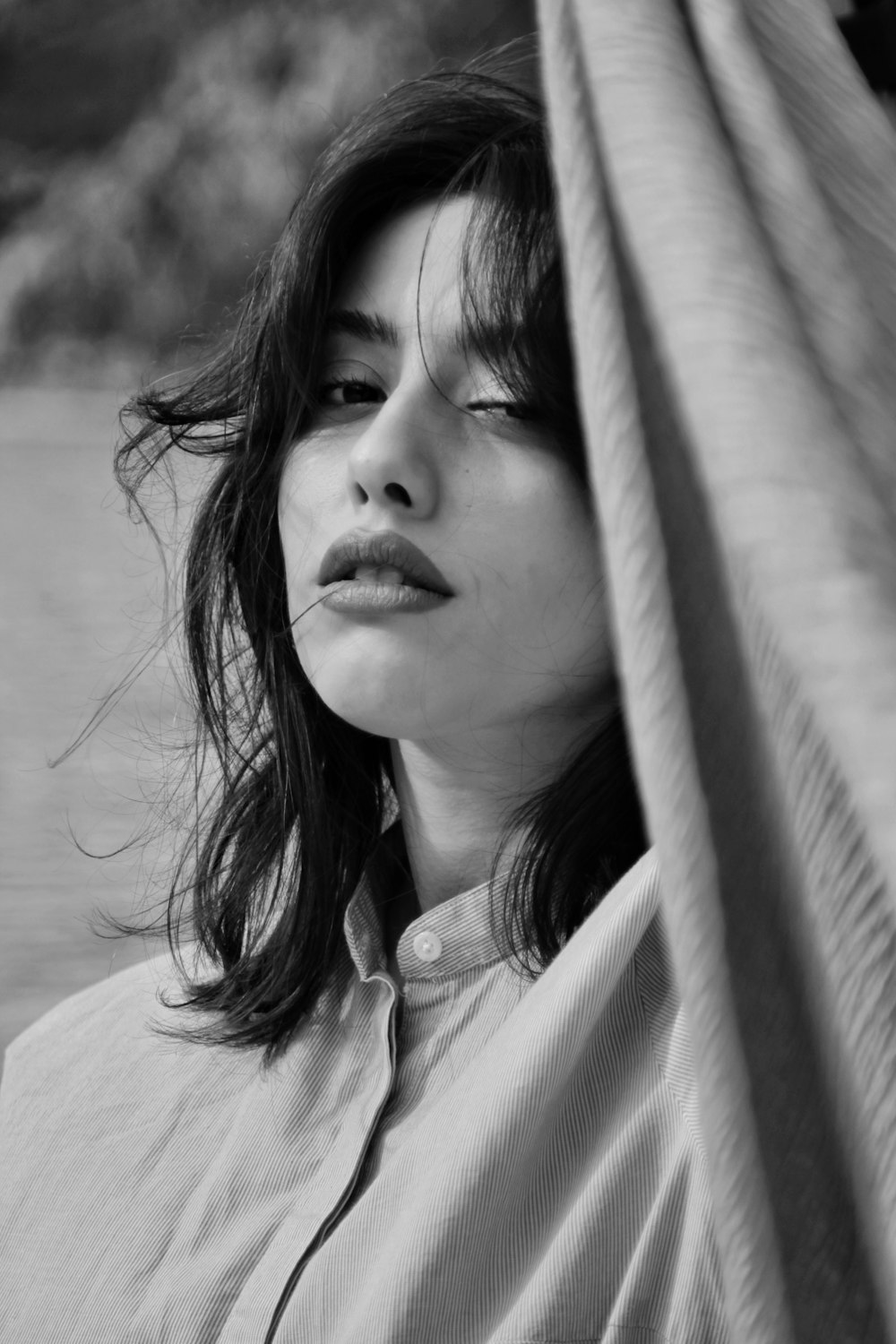 a black and white photo of a woman with her eyes closed