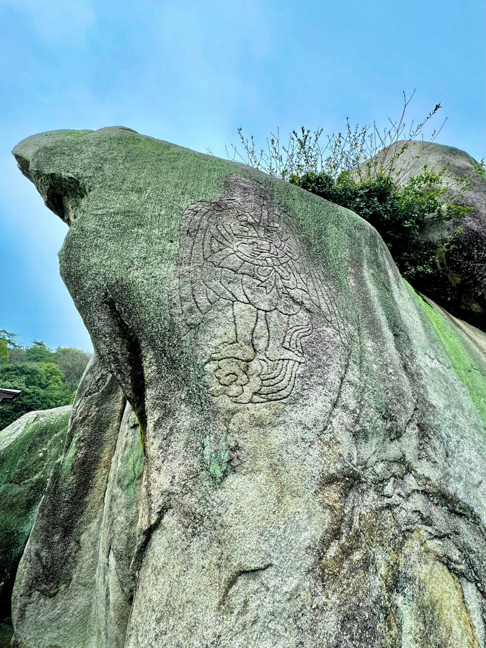 a rock with a carving of a dragon on it