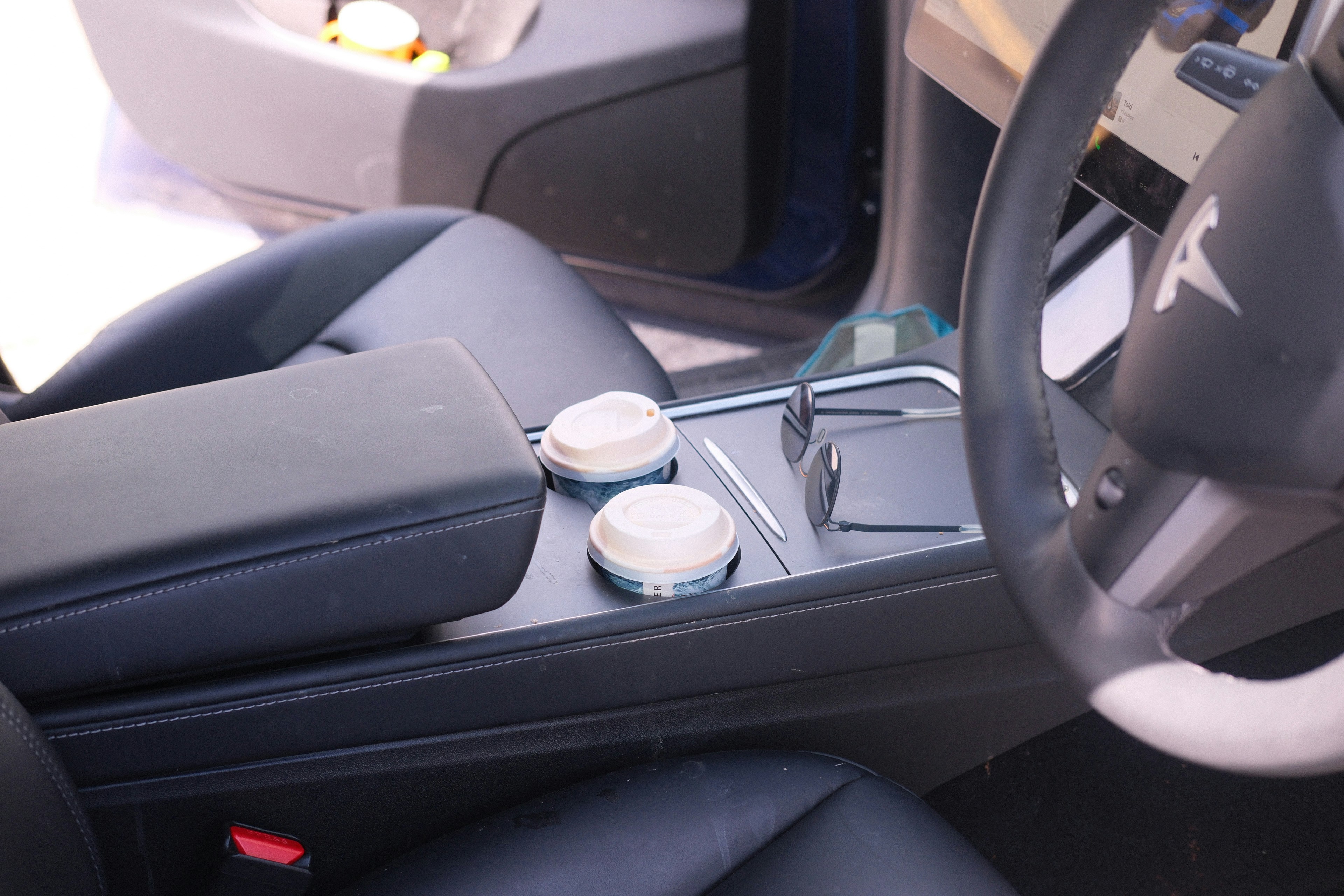 Modern Jaguar-style luxury EV interior with digital cockpit and leather seating