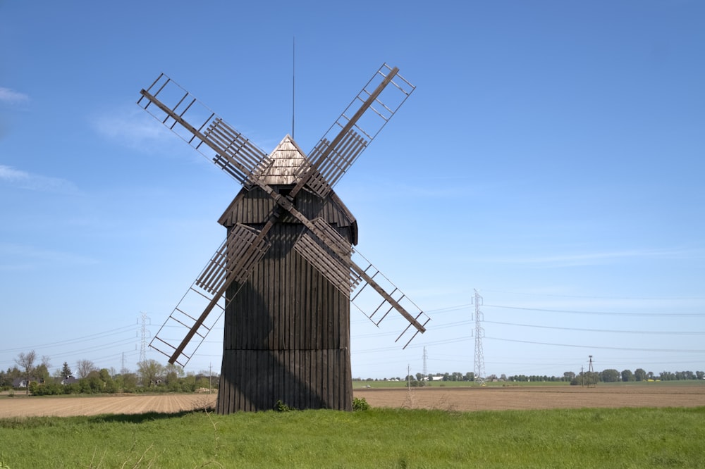 a windmill in the middle of a field
