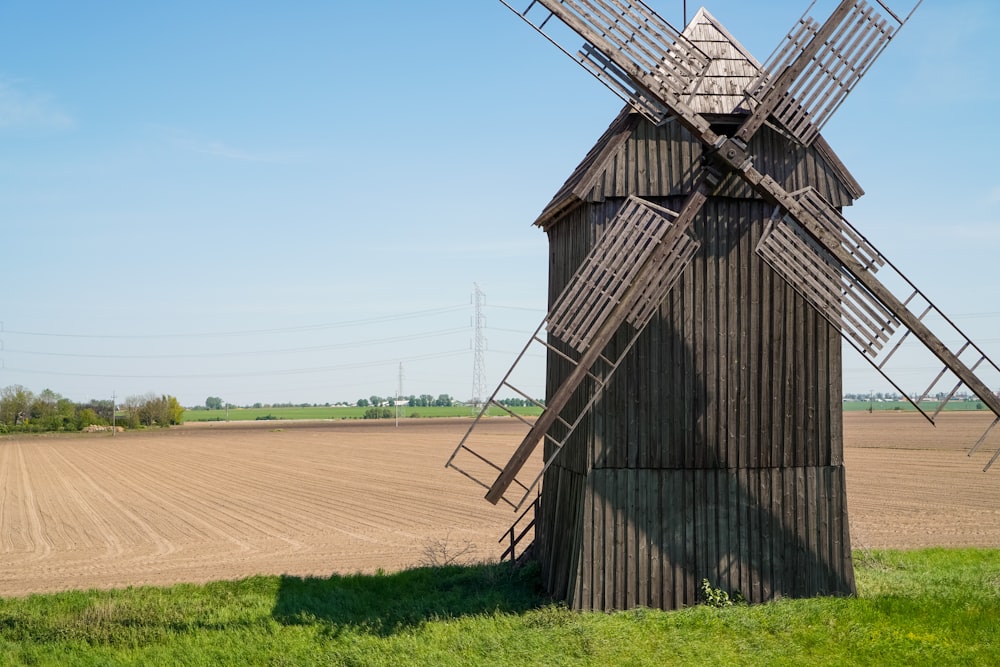 a windmill in the middle of a field