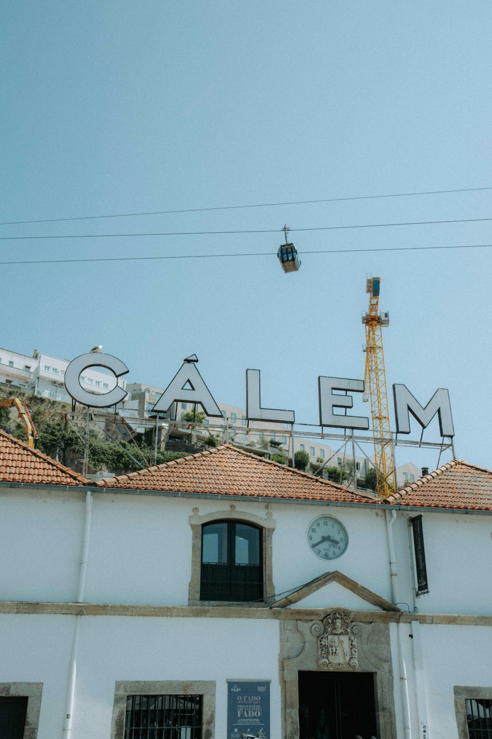 a white building with a clock on top of it